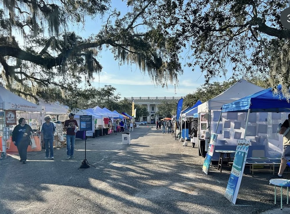 Shoppers browsing the Winthrop Pop Up Market — an outdoor artisan and small-business market held the third Saturday of the month, October through May, in Riverview, Florida.